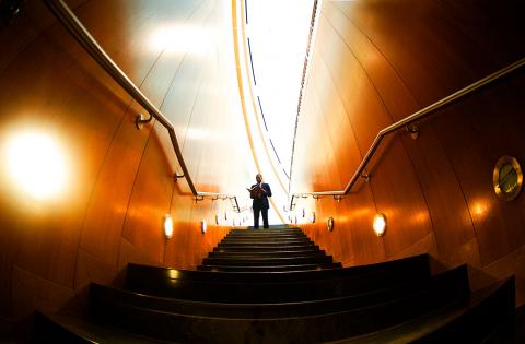 Man Standing in Hallway Stairs